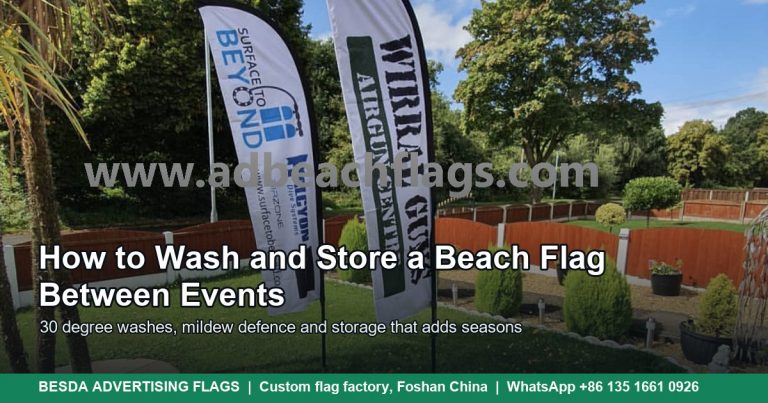Two printed feather flags on a lawn ready for washing and storage