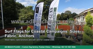 Feather flags standing outdoors on a coastal site