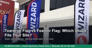 Teardrop and feather advertising flags standing in front of a storefront